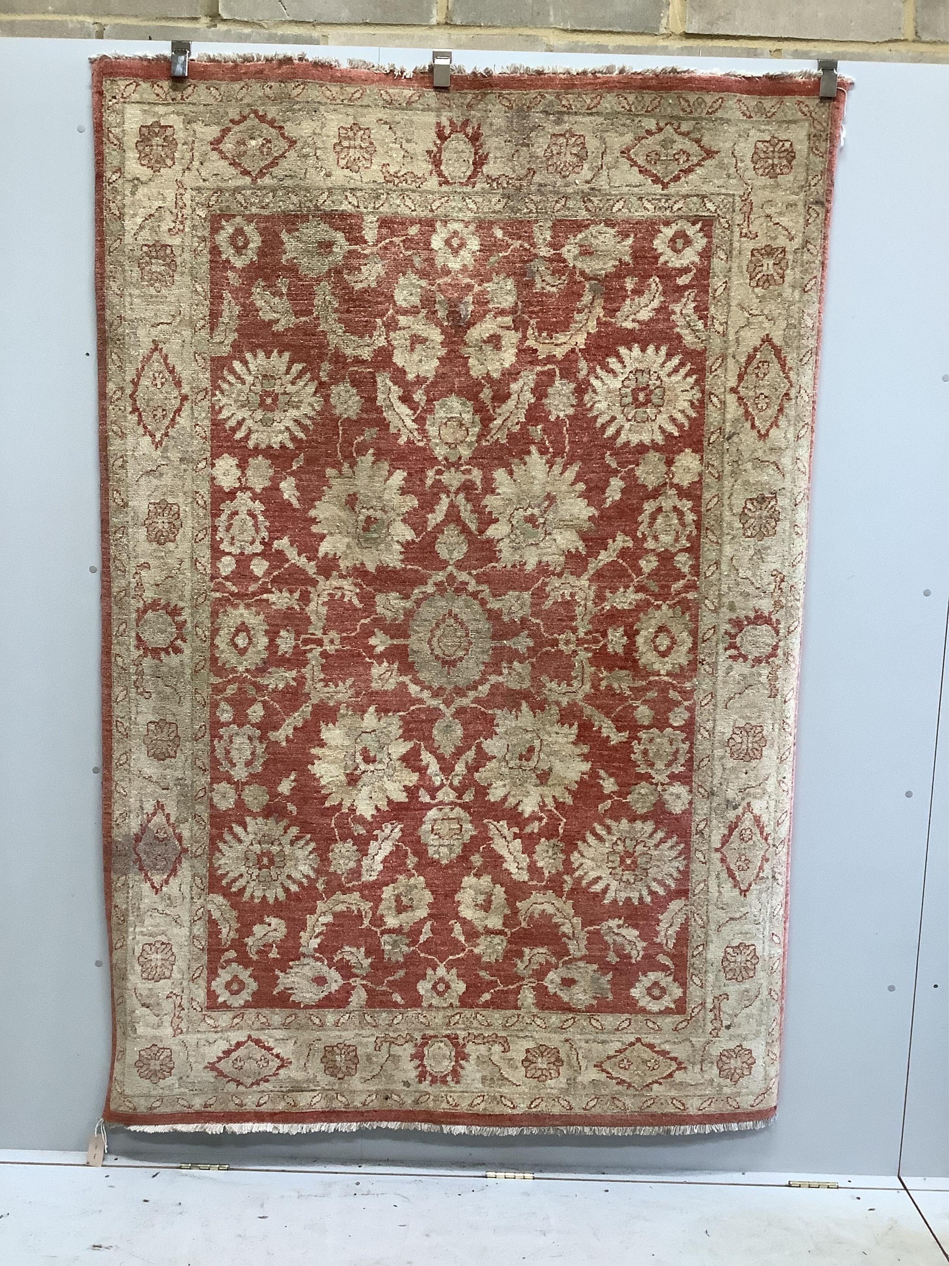 A Persian small carpet, 152 x 222cm. Condition - fair, red wine stain to one side